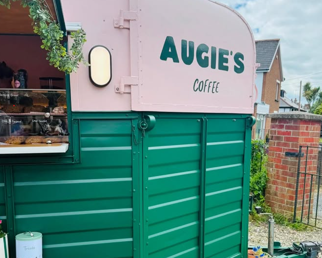 The hand-painted Augie's Coffee sign on the side of the horsebox